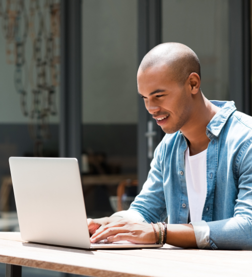 person on laptop outside 