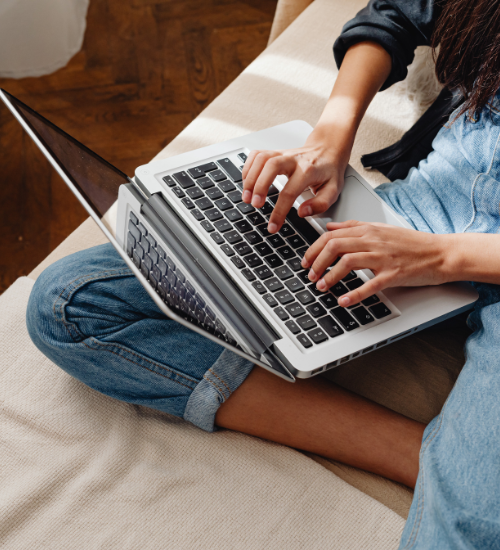 person on laptop in bed